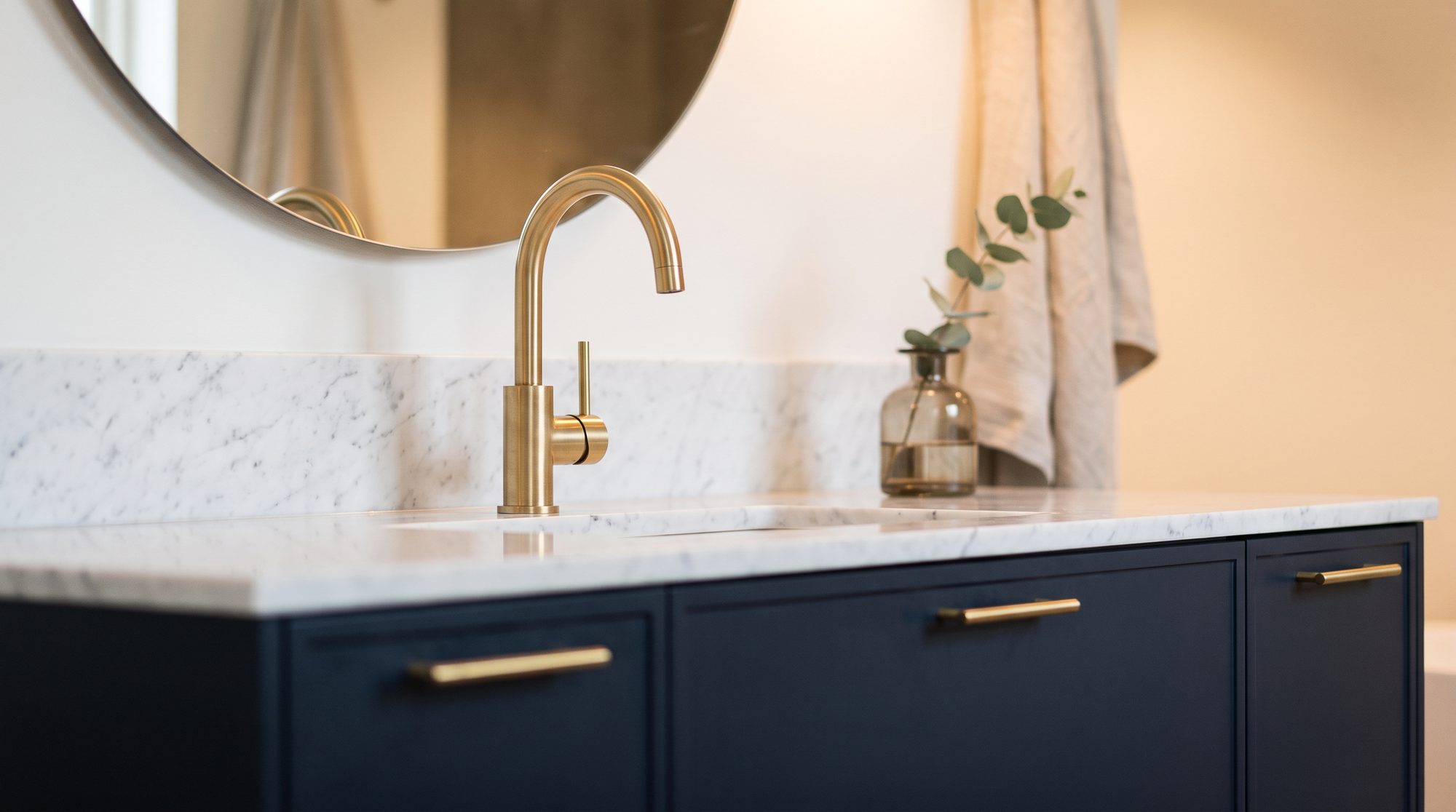 Navy cabinetry with brass pulls